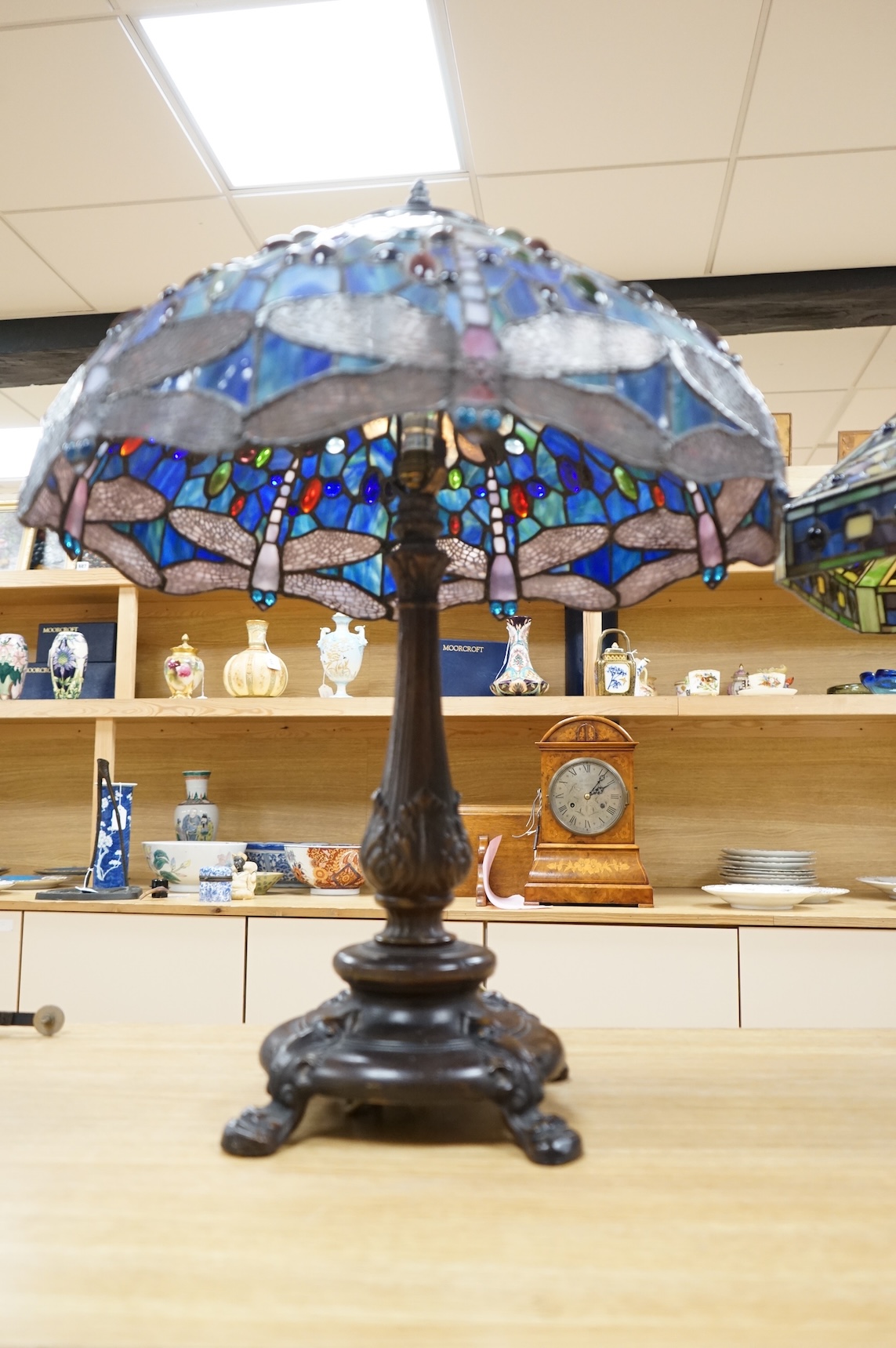 Two Tiffany style table lamps, with ornate glass and metal shades, tallest 72cm high